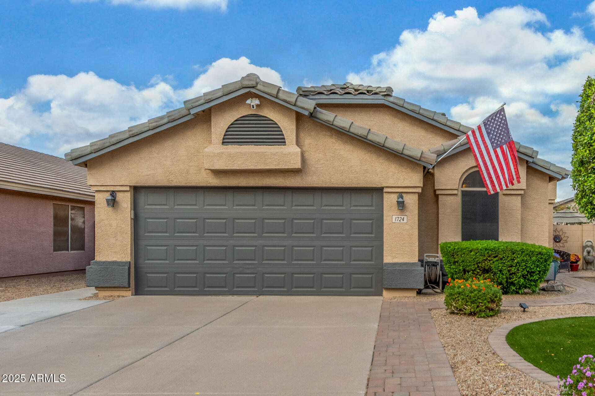 a front view of a house with garage