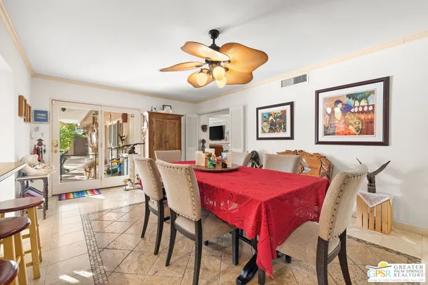a view of a dining room and livingroom with furniture