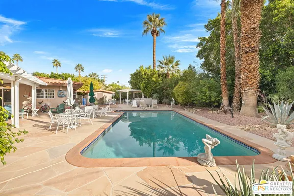 a view of a swimming pool with a patio