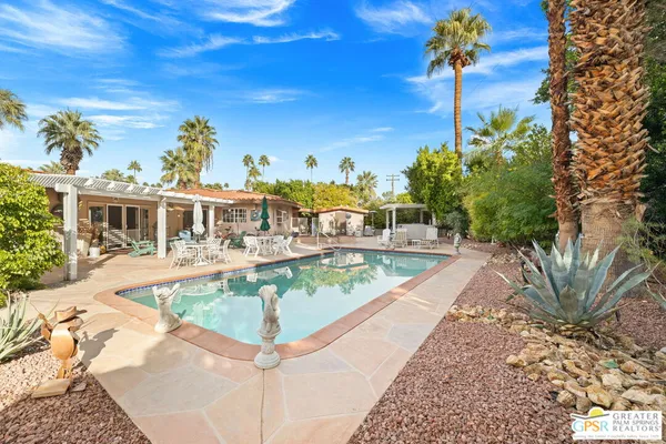 a view of a house with swimming pool