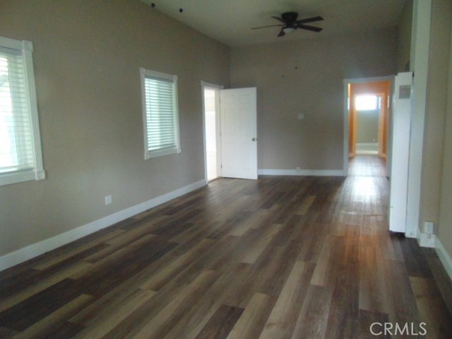 1359 2nd Street Red Bluff, CA 96080 - Photo 2 of 12 an empty room with wooden floor and windows