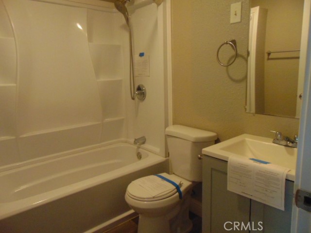 1359 2nd Street Red Bluff, CA 96080 - Photo 5 of 12 a bathroom with a sink toilet and shower