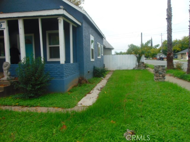 1359 2nd Street Red Bluff, CA 96080 - Photo 9 of 12 a view of a house with a yard and a garden