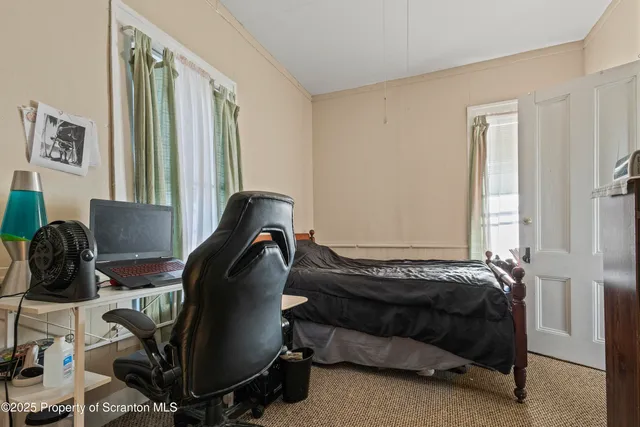 a bed room with a bed and a window