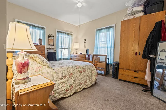 a bed room with a bed and a couch