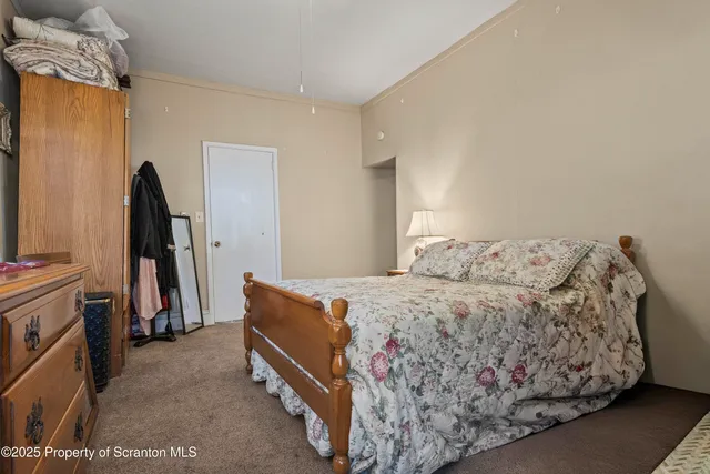 a view of a kitchen with a table and chairs