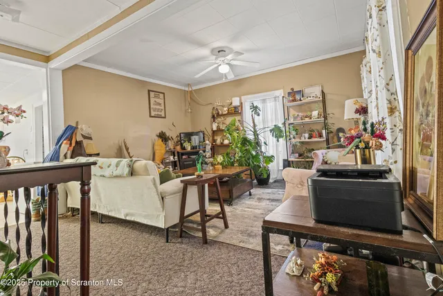 a bedroom with a bed and a tv