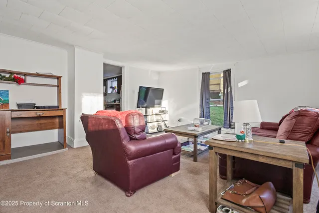 a living room with furniture and a couch