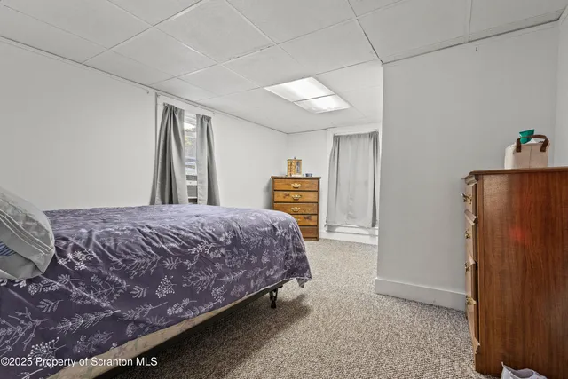 a bedroom with a bed and a cabinets