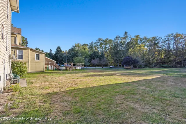 a view of a swimming pool with an outdoor space and seating area