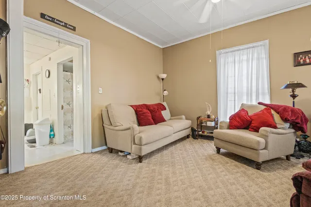 a living room with furniture and a window