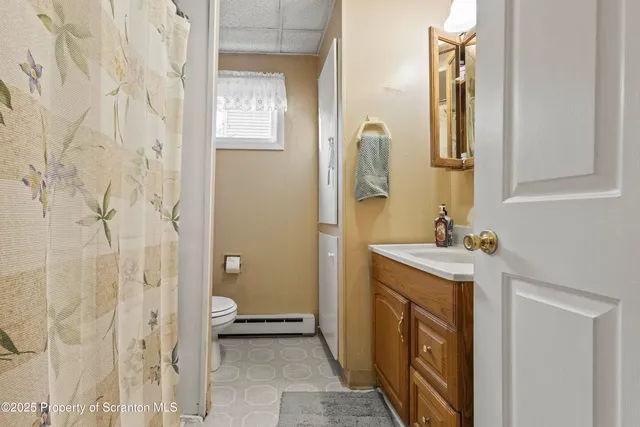 a bathroom with a sink and mirror