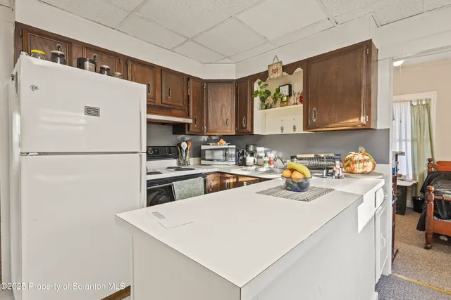 a bedroom with a bed a desk and chair