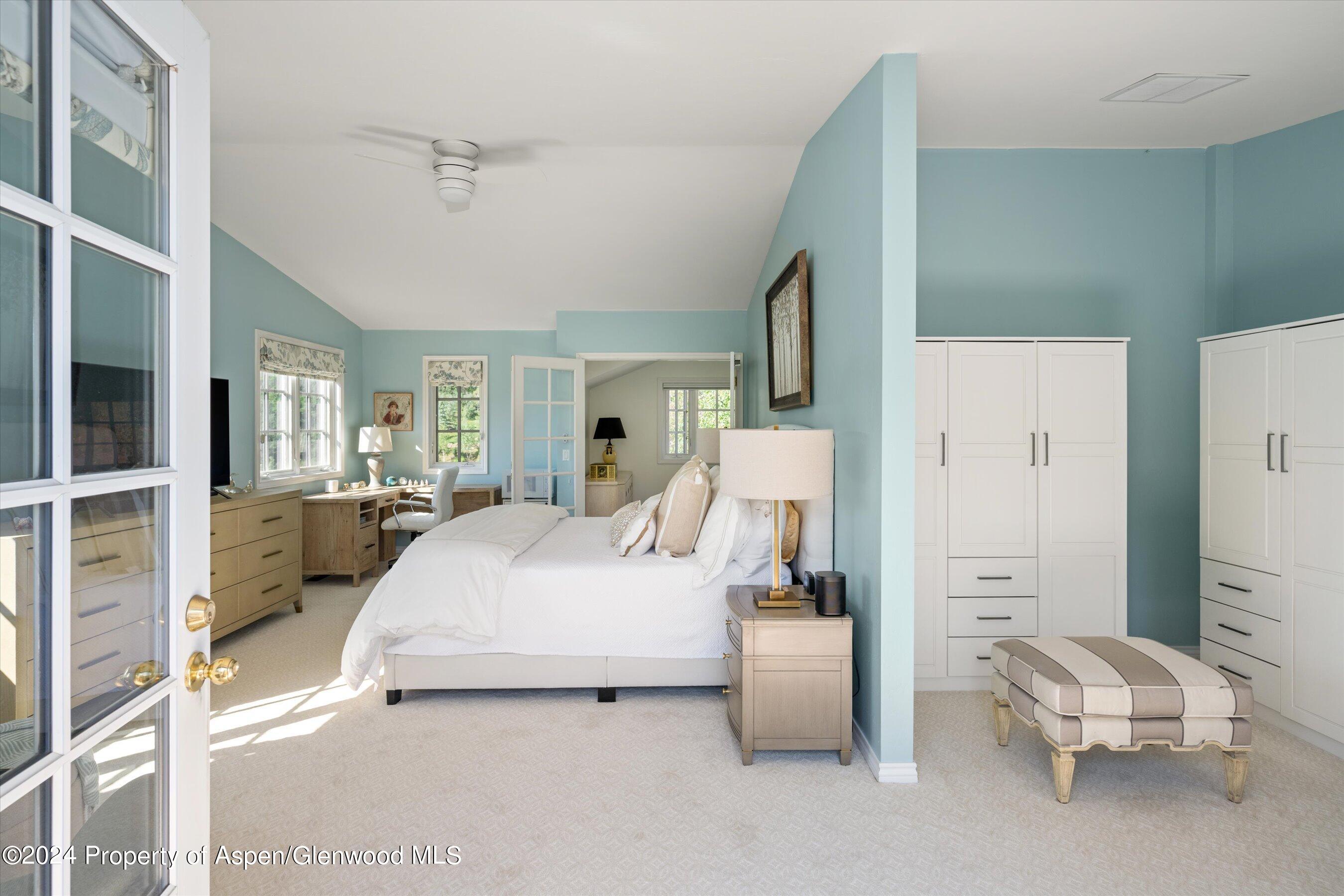 407 Gateway Road Snowmass, CO 81654 - Photo 17 of 37 a bedroom with a bed and a view of living room