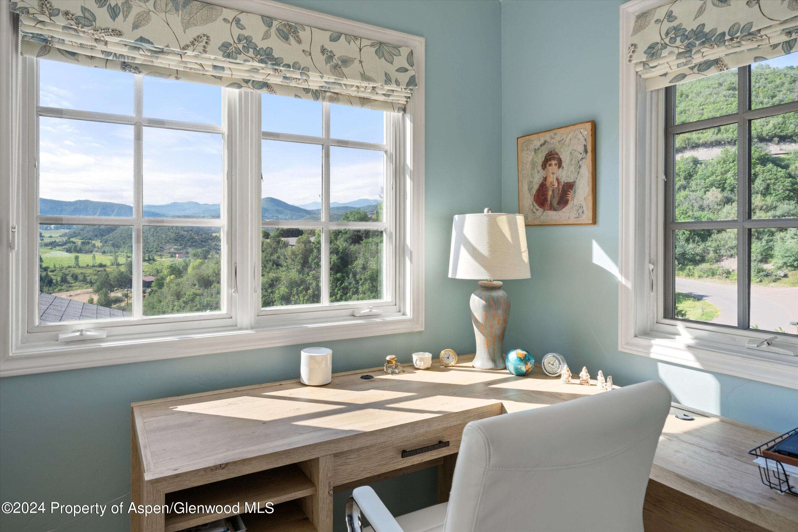 407 Gateway Road Snowmass, CO 81654 - Photo 18 of 37 a dining room with a window table and chairs