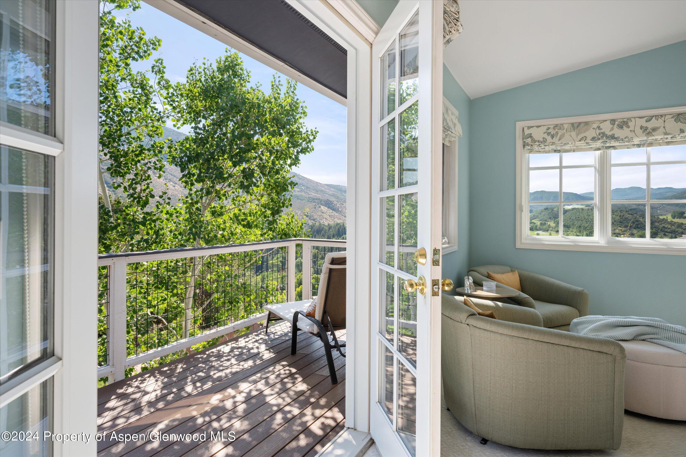 407 Gateway Road Snowmass, CO 81654 - Photo 20 of 37 a living room with furniture and a window