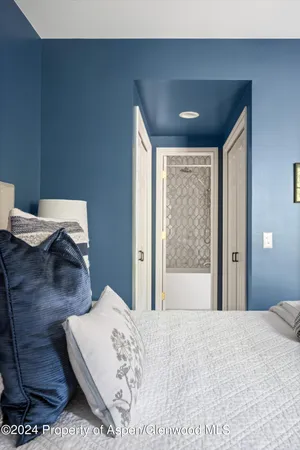 a bathroom with a white wall