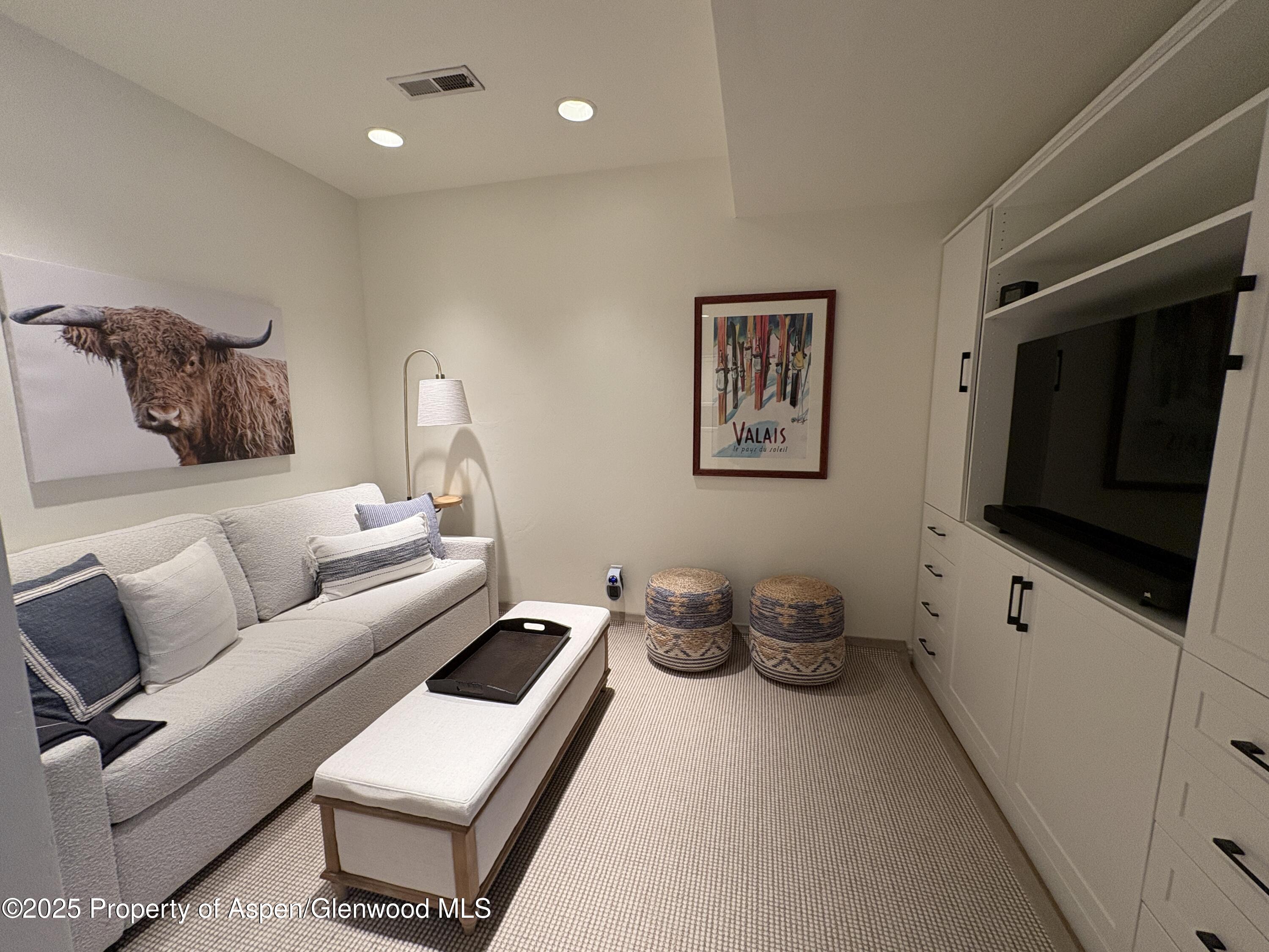 407 Gateway Road Snowmass, CO 81654 - Photo 30 of 37 a living room with furniture and a flat screen tv