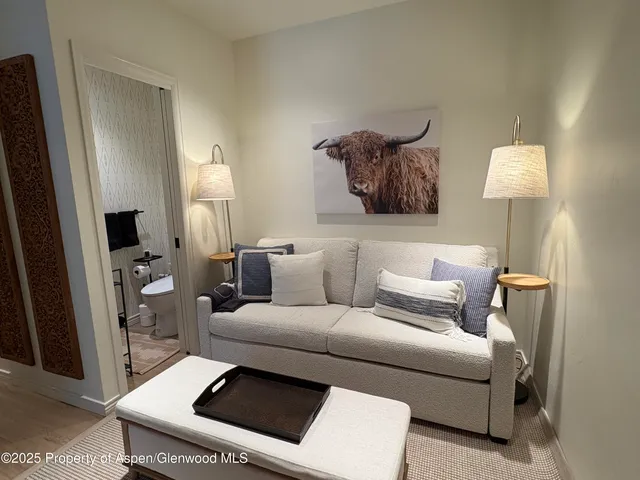 a bathroom with a toilet a sink and a mirror