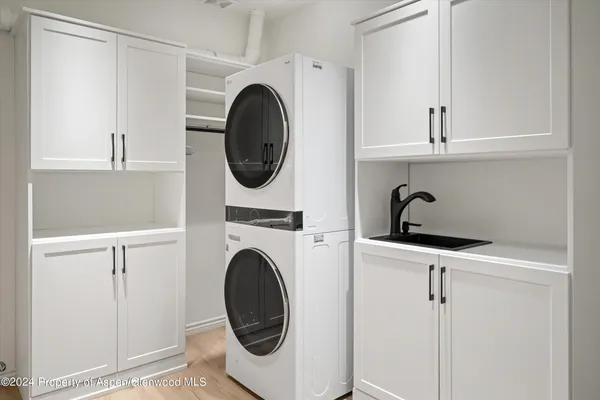 a view of hallway with a window and entryway