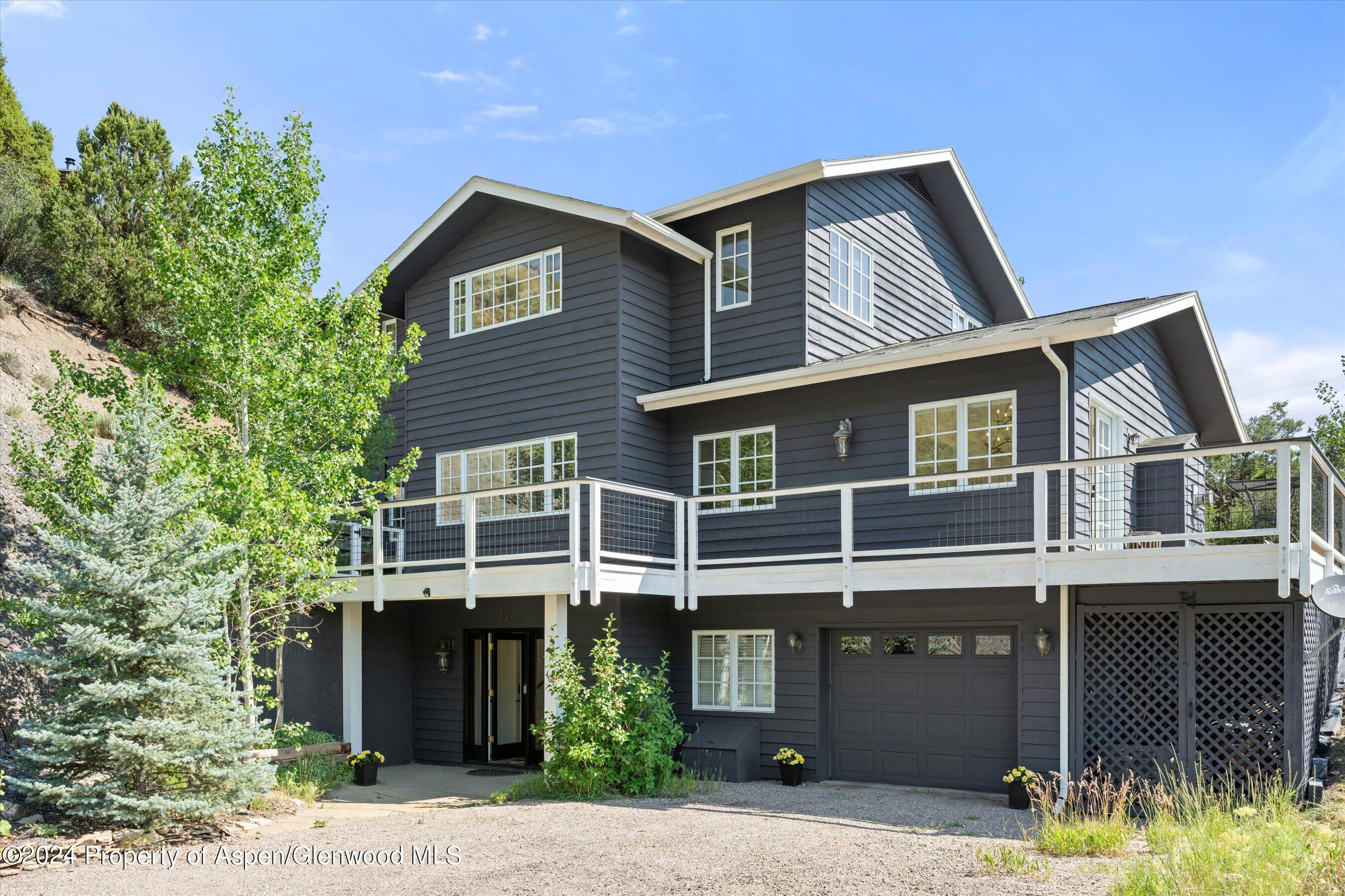 407 Gateway Road Snowmass, CO 81654 - Photo 37 of 37 a front view of a house with a yard