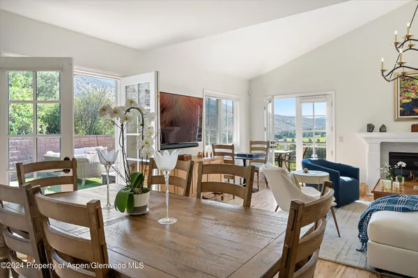 a living room with fireplace furniture and a flat screen tv