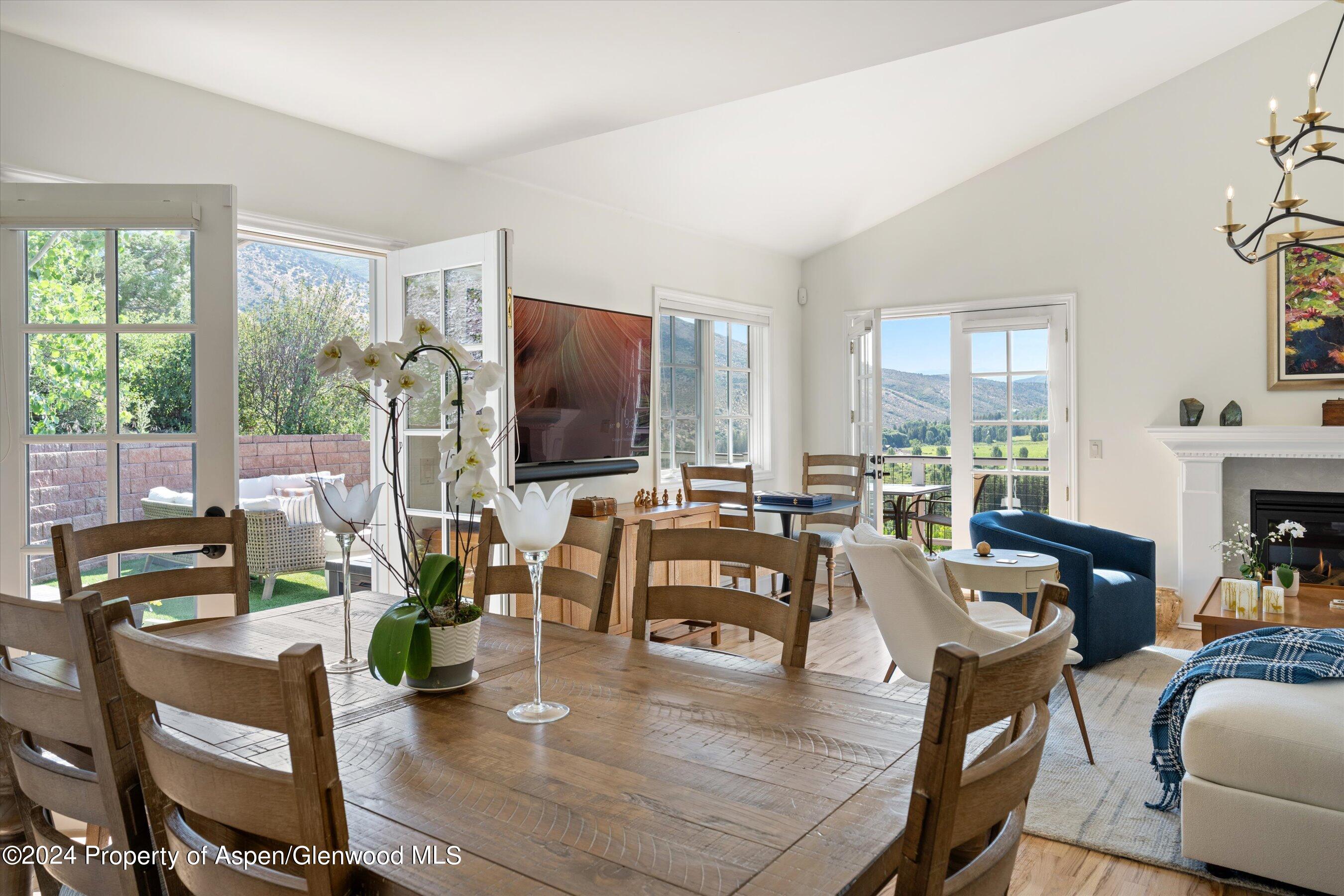 407 Gateway Road Snowmass, CO 81654 - Photo 6 of 37 a living room with fireplace furniture and a flat screen tv