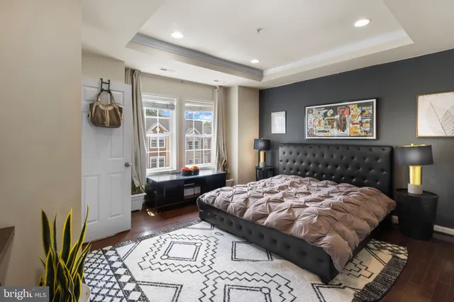 a bedroom with a bed and a couch