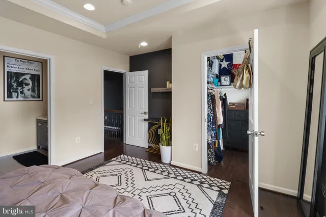 a bedroom with a bed and a walk in closet