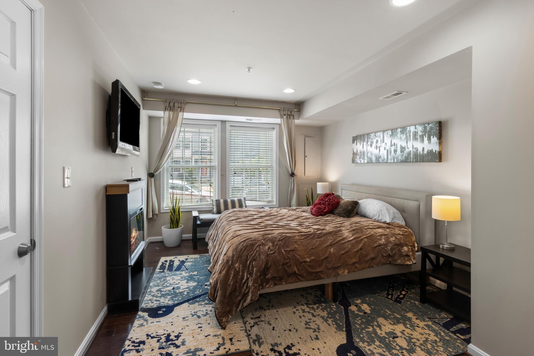 1778 W Street Southeast Washington, DC 20020 - Photo 25 of 44 a bedroom with a bed window and flat screen tv