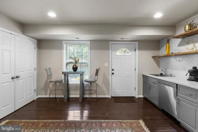 a kitchen with stainless steel appliances granite countertop a stove and cabinets