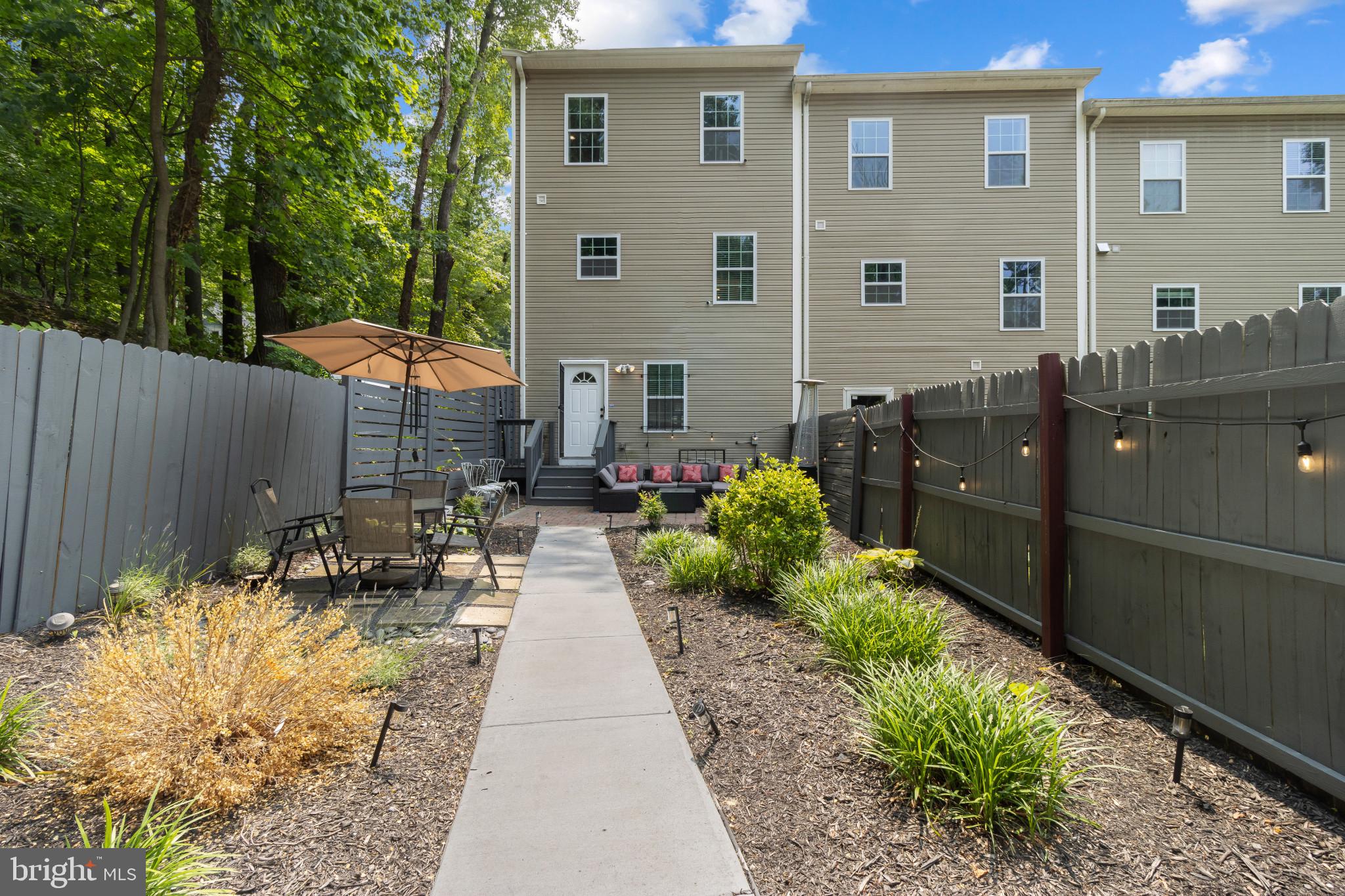 1778 W Street Southeast Washington, DC 20020 - Photo 38 of 44 a front view of a house with a yard