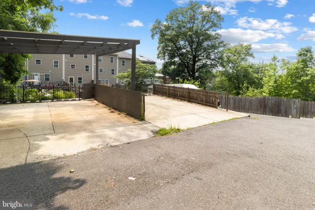 a picture of a bench in front of a wall