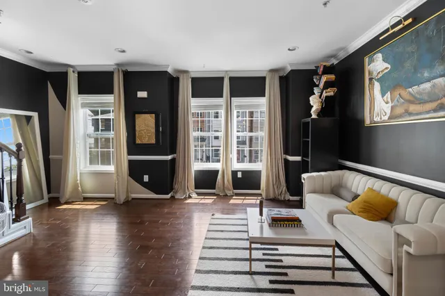 a view of a living room with furniture and a rug