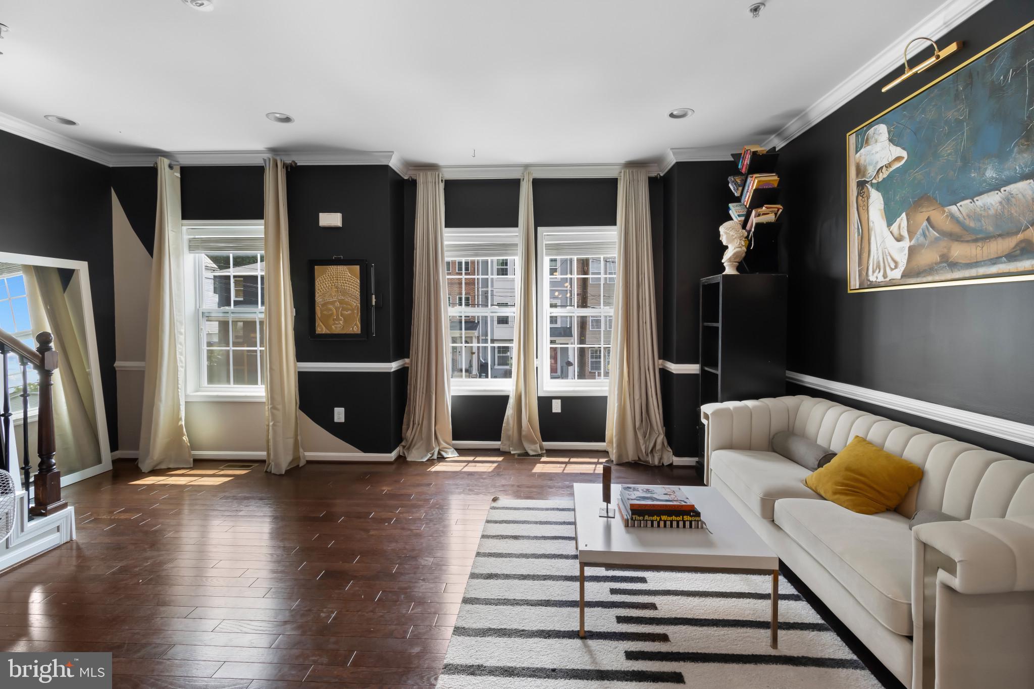 1778 W Street Southeast Washington, DC 20020 - Photo 7 of 44 a view of a living room with furniture and a rug