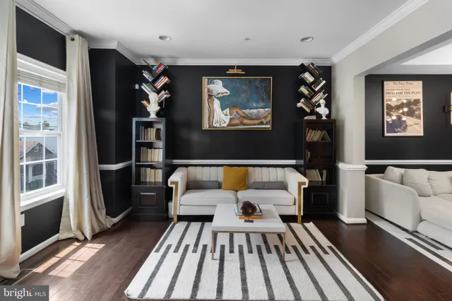 a living room with furniture and a rug