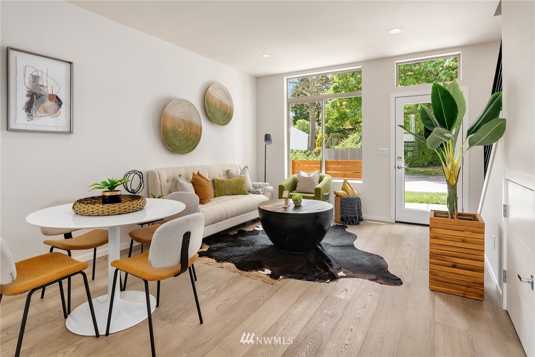 8370 Loyal Way Northwest, Unit B Seattle, WA 98117 - Photo 6 of 19 a living room filled with furniture and a large window