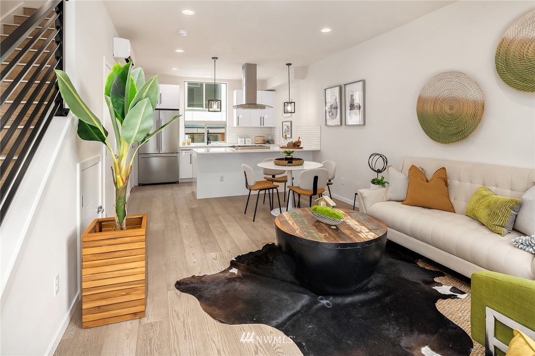 8370 Loyal Way Northwest, Unit B Seattle, WA 98117 - Photo 7 of 19 a living room with furniture a rug and a potted plant