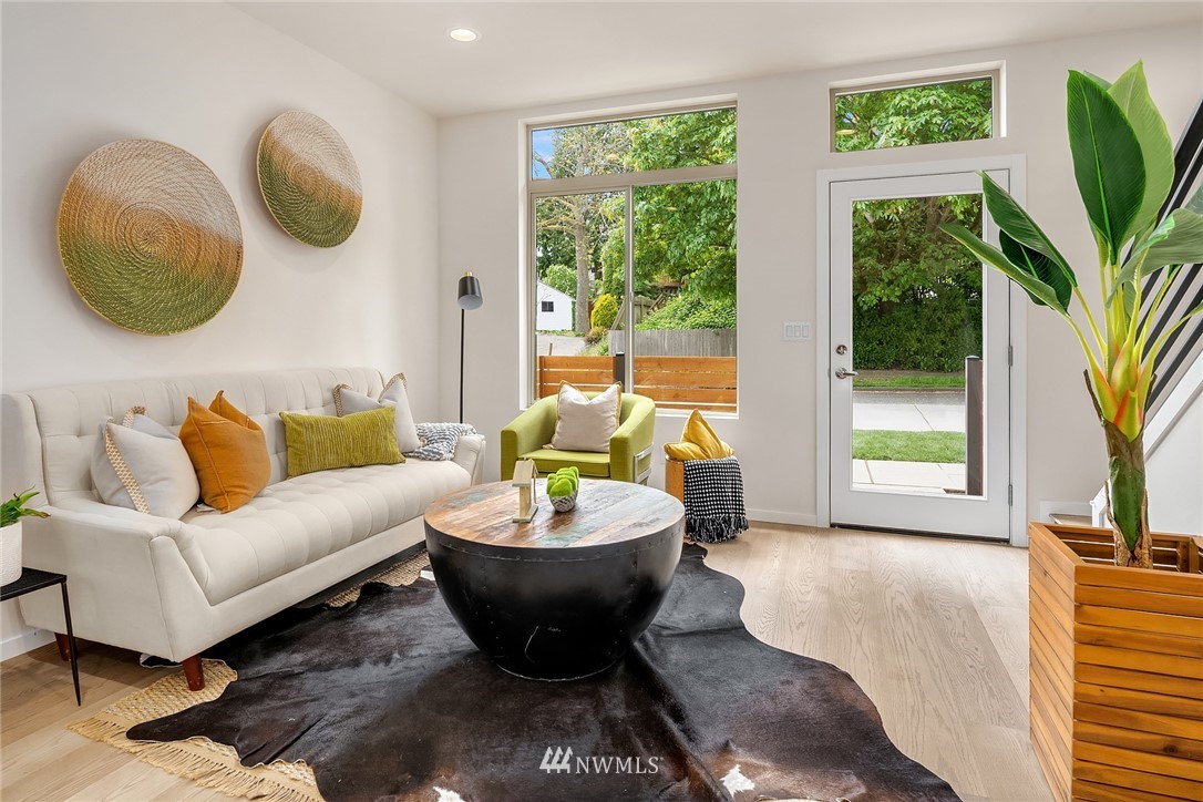 8370 Loyal Way Northwest, Unit B Seattle, WA 98117 - Photo 8 of 19 a living room with furniture and a large window