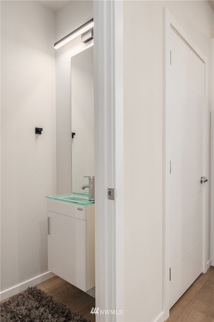 8370 Loyal Way Northwest, Unit B Seattle, WA 98117 - Photo 9 of 19 a bathroom with a sink and vanity