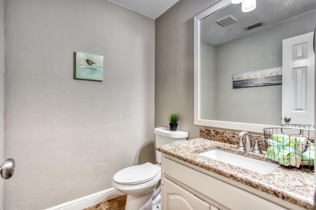 5421 North Briar Ridge Circle McKinney, TX 75072 - Photo 15 of 27 Bathroom featuring vanity and a textured wall