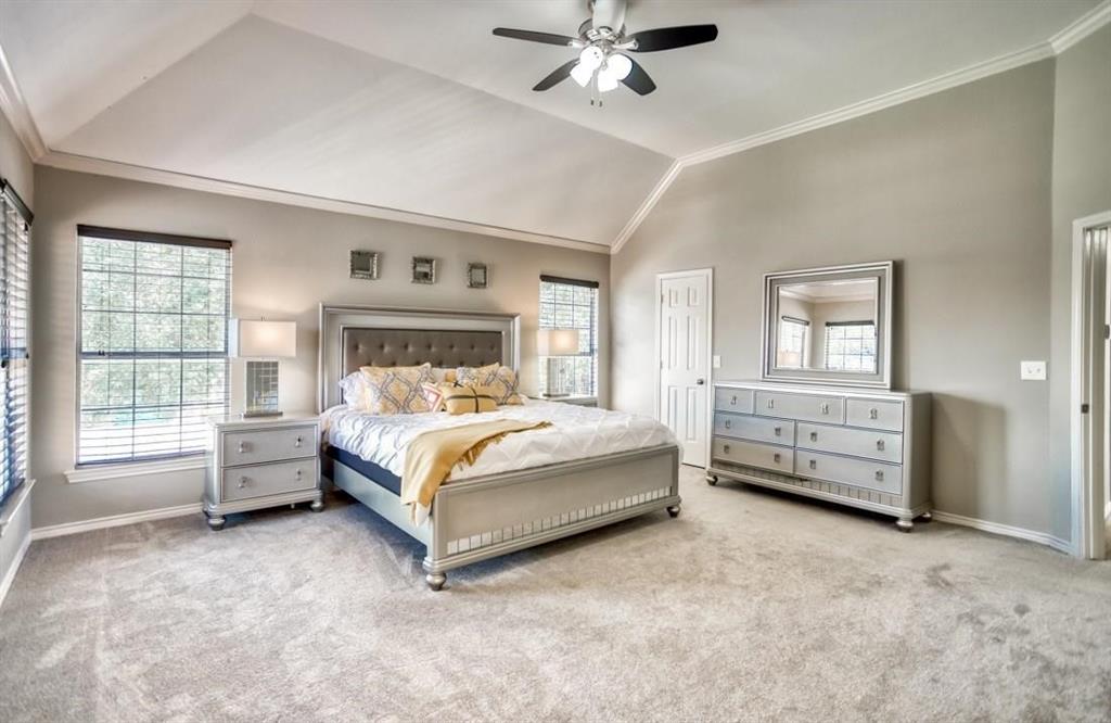 5421 North Briar Ridge Circle McKinney, TX 75072 - Photo 16 of 27 Bedroom with crown molding, vaulted ceiling, carpet floors, and a ceiling fan