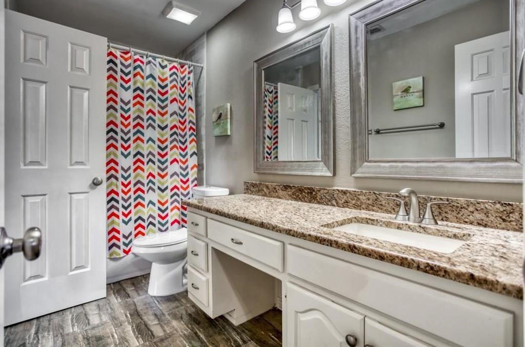 5421 North Briar Ridge Circle McKinney, TX 75072 - Photo 20 of 27 Full bathroom featuring vanity, dark wood-type flooring, and shower / tub combo with curtain