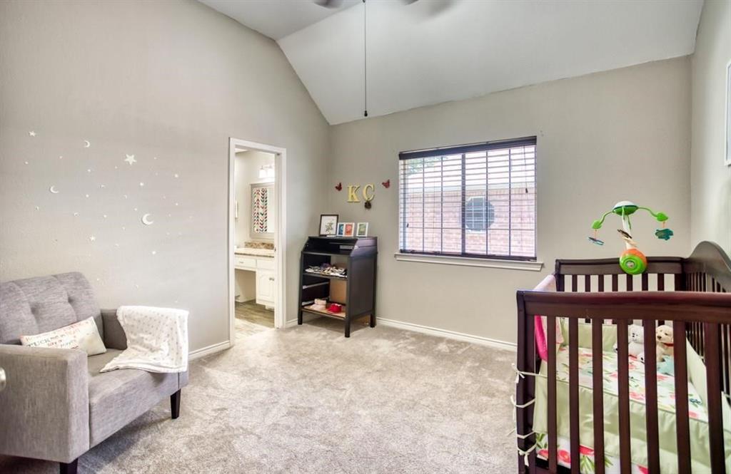 5421 North Briar Ridge Circle McKinney, TX 75072 - Photo 21 of 27 Bedroom with light colored carpet, a nursery area, high vaulted ceiling, and ceiling fan