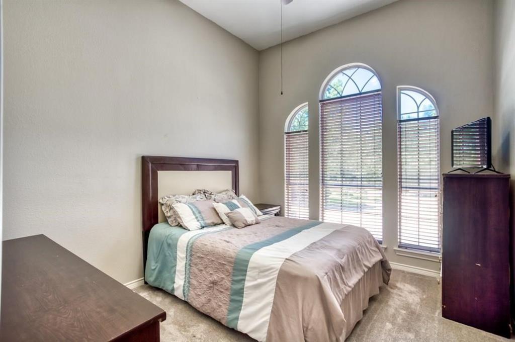 5421 North Briar Ridge Circle McKinney, TX 75072 - Photo 22 of 27 Carpeted bedroom featuring baseboards