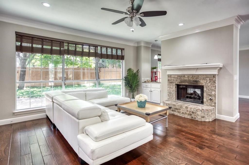 5421 North Briar Ridge Circle McKinney, TX 75072 - Photo 5 of 27 Living room with crown molding, a fireplace, dark wood-style flooring, ceiling fan, and recessed lighting