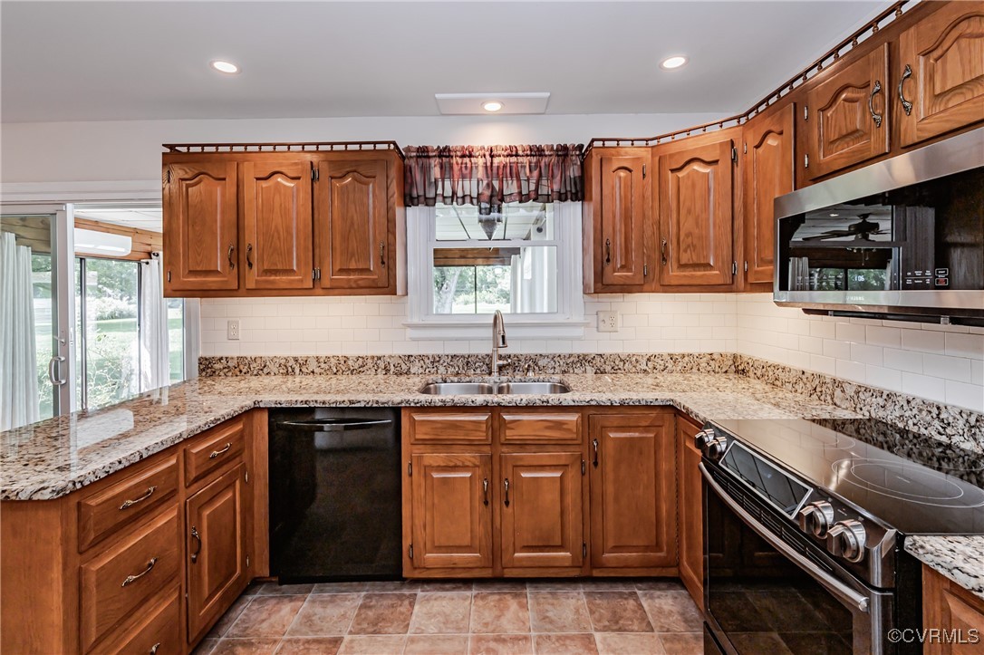 3804 Malpas Drive Sandston, VA 23150 - Photo 16 of 45 a kitchen with a sink stove top oven and cabinets