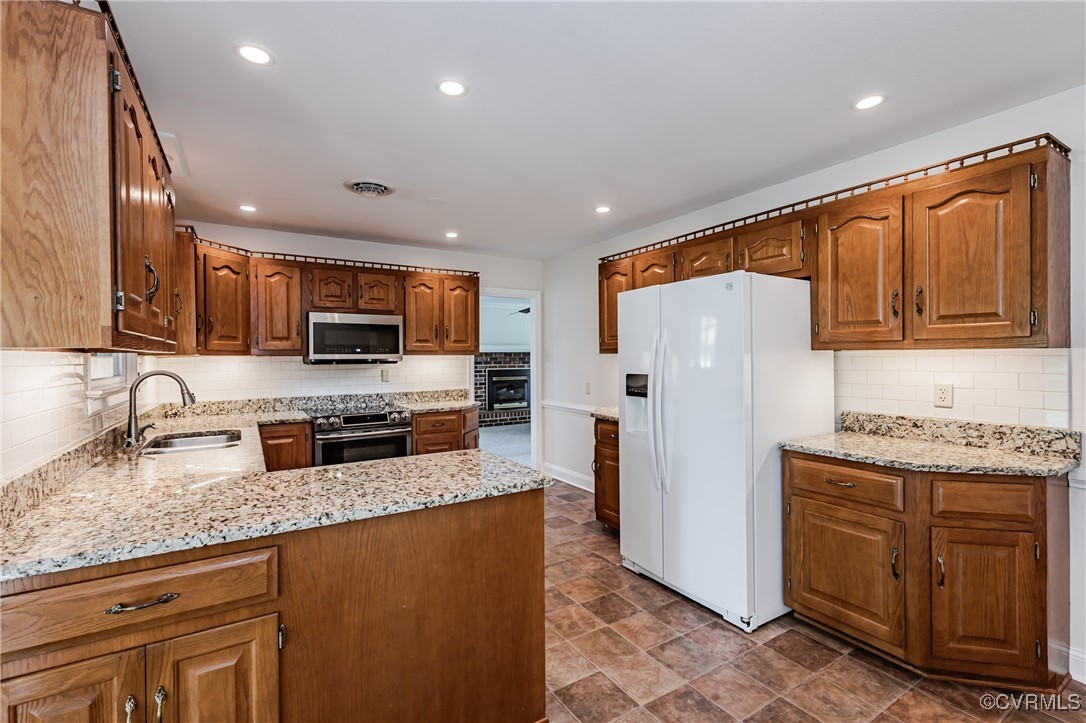 3804 Malpas Drive Sandston, VA 23150 - Photo 23 of 45 a kitchen with stainless steel appliances granite countertop a refrigerator stove microwave and sink
