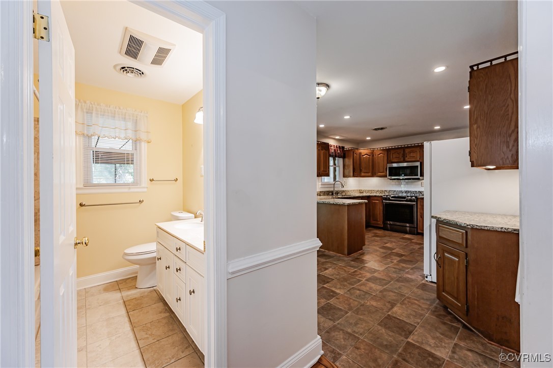 3804 Malpas Drive Sandston, VA 23150 - Photo 34 of 45 a bathroom with a sink a toilet and shower