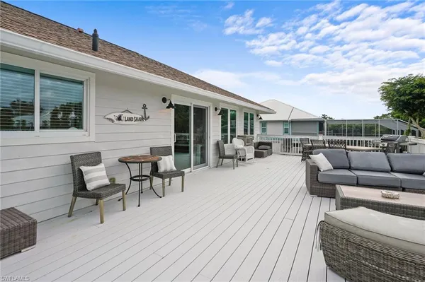 a front view of a house with a yard table and chairs